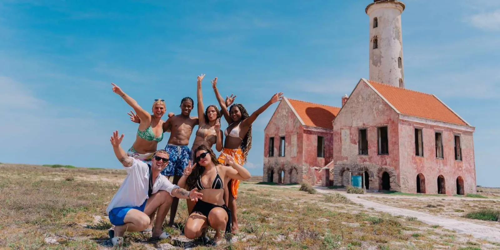 A tour group gathered at the ruined lighthouse keeper's house on Klein Curacao